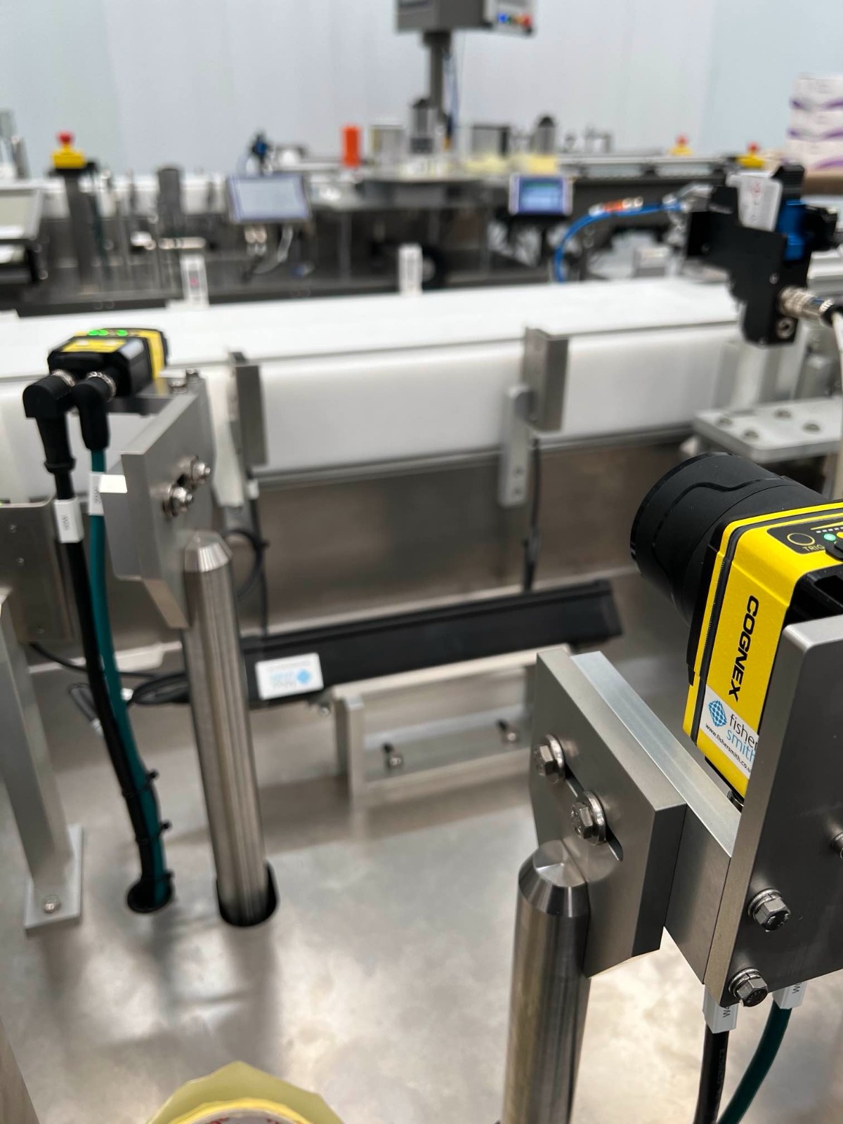 Cognex In-Sight smart camera installed on a Fisher Smith production line